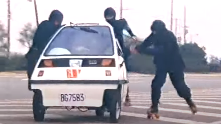 Microcar outruns roller-skating ninjas