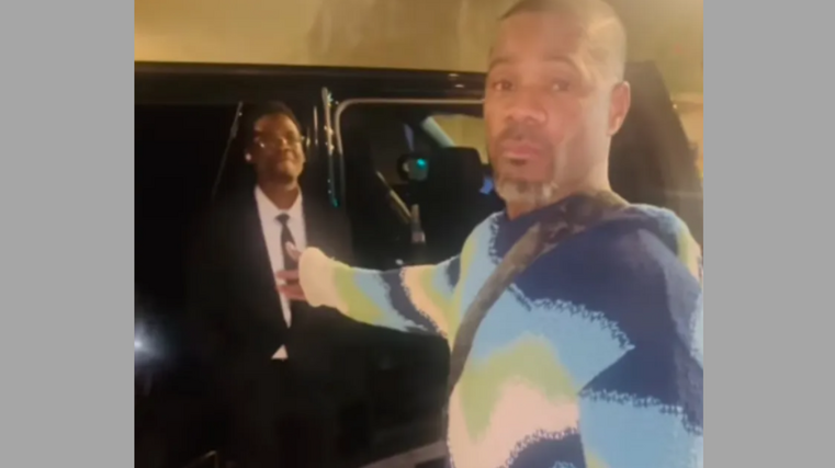 Singer bungles getting into car