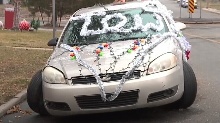 Festive trimmings for ditched car