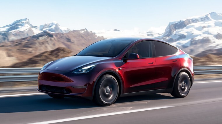 Tesla predicts slower sales growth