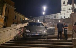 Luxury car stuck on landmark
