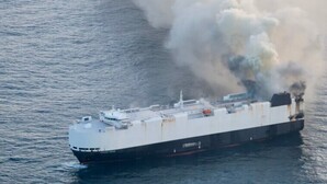 Car carrier sinks after blaze