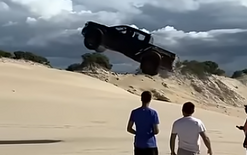 Ute in crazy sand dune jump