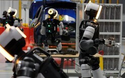 Robots train for car production